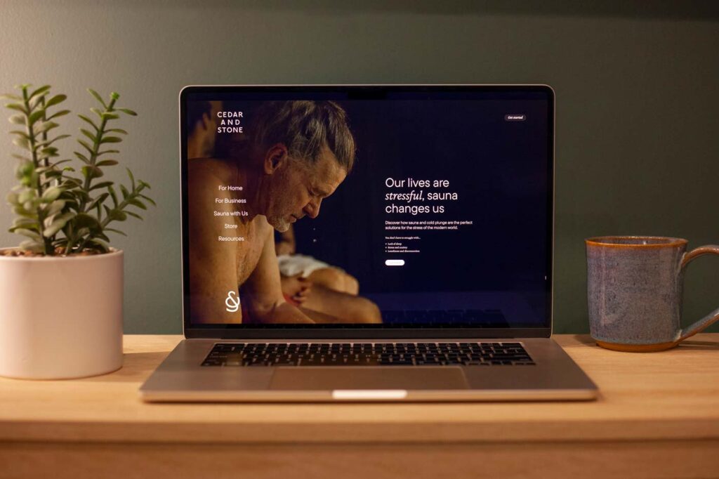 Home page design of Cedar & Stone Sauna on a laptop